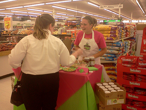 Courtney at the 6C's Salsa sample stand handing out salsa and chips.